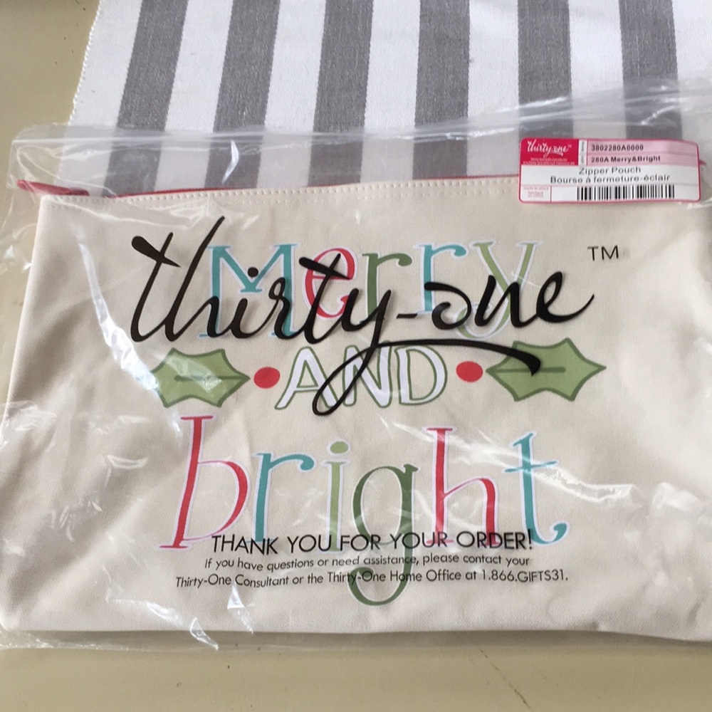 Thirty-one Merry and Bright zipper pouch. New in packaging